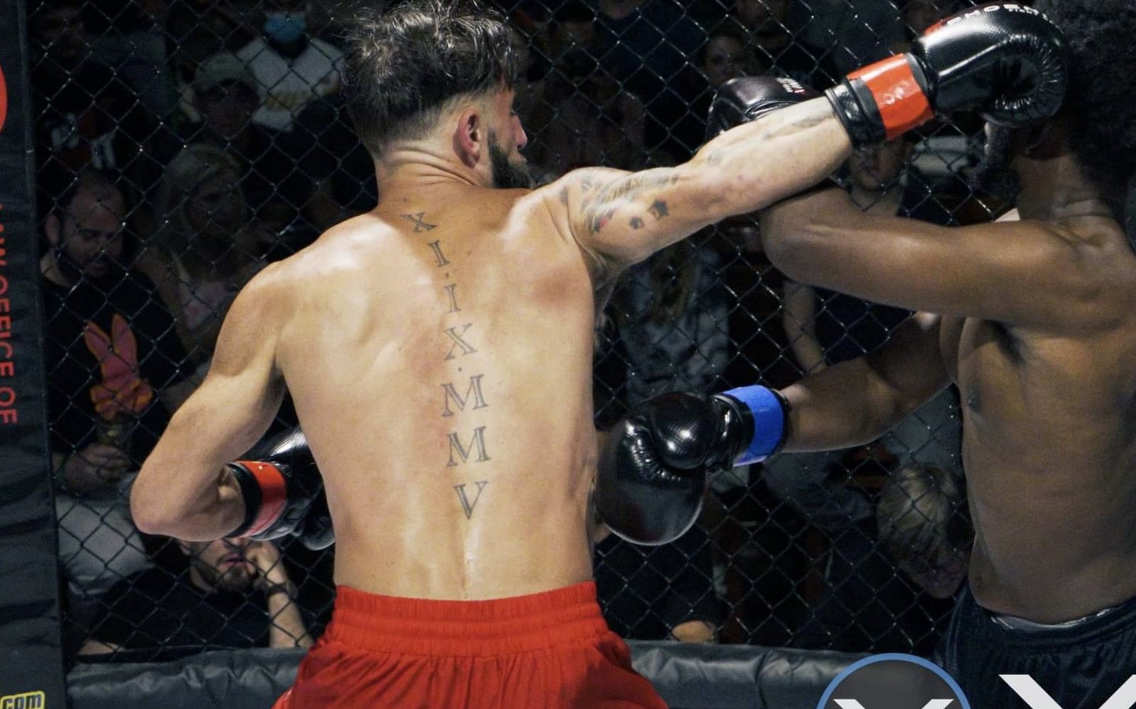 Two fighters exchanging punches in the cage during a live Undisputed fight